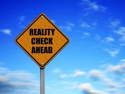 Reality Check Ahead sign